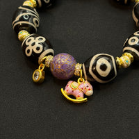 Multi-Treasure Dzi Bracelet
(小木马达洛多宝天珠手串)