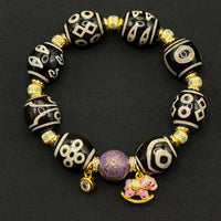 Multi-Treasure Dzi Bracelet
(小木马达洛多宝天珠手串)