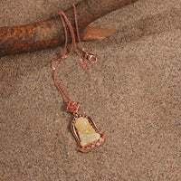 Amber Buddha Pendant