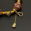Himalayn Pink Dzi Bead Bracelet (达洛天珠手串葫芦吊坠）