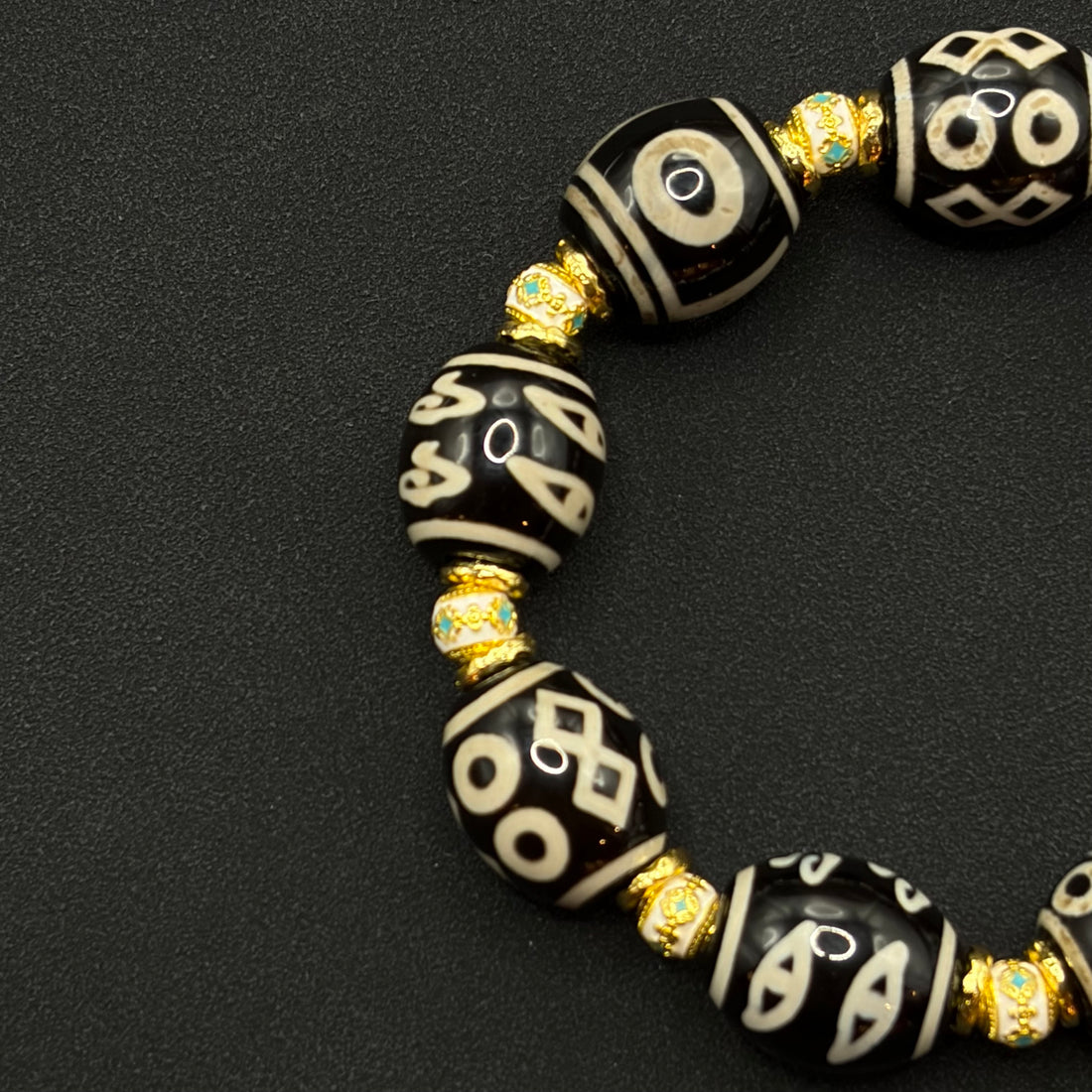 Multi-Treasure Dzi Bracelet
（小木马达洛多宝天珠手串）